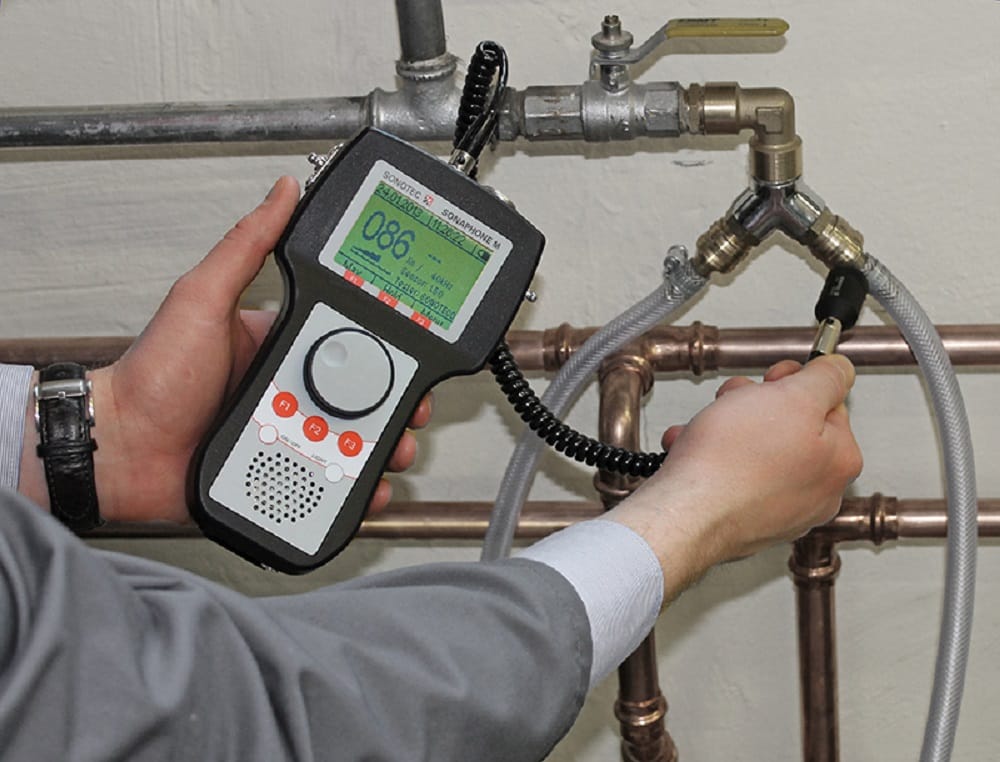 Plumber testing pipes with electronic leak detection equipment in Smyrna