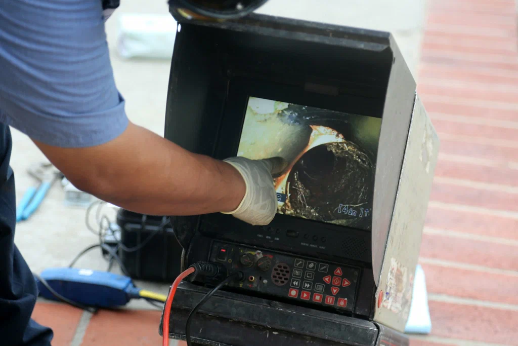 Technician viewing a drain inspection camera in Smyrna
