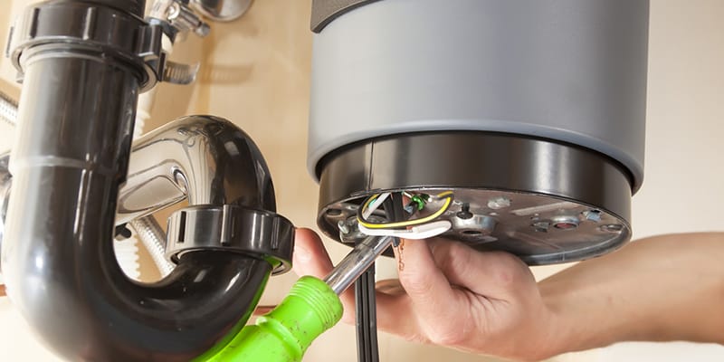 Technician repairing the heating element of a water heater in Smyrna